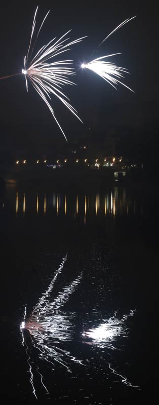 Firework with its reflections in the water